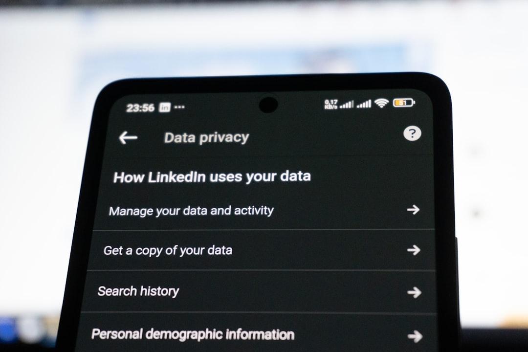 A LinkedIn Data privacy settings menu open on a smartphone screen, showing options for managing your data and activity, search history, and personal demographic information.