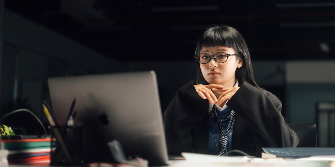 A mid-career professional sits at a laptop looking pensive during a long, rejection-filled job search